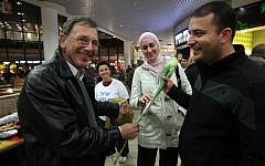 Activists protest the racially motivated attack on Arab workers at Jerusalem's Malha mall on March 19 (photo credit: Yossi Zamir/Flash 90)