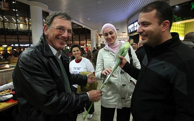 Activists protest the racially motivated attack on Arab workers at Jerusalem's Malha mall on March 19 (photo credit: Yossi Zamir/Flash 90)