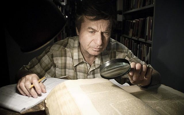Actor Shlomo Bar Aba pours over a page of Talmud in 'Footnote', released in the US this Friday. (Photo credit: Sony)
