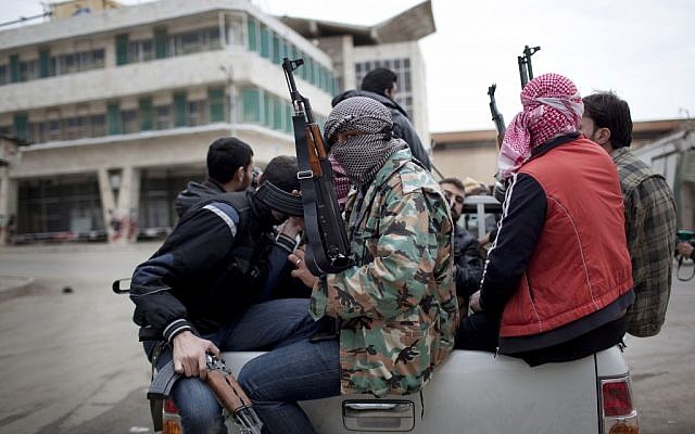 Free Syrian Army rebel fighters prepare to fight approaching Syrian Army tanks in Idlib, northern Syria. (photo credit: AP/Rodrigo Abd)