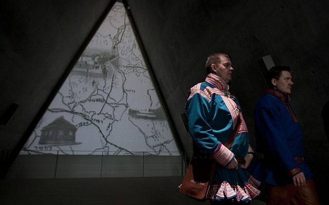 Nils Ante Eira, center right, and Lars Joar Halonen, Sami of Norway, visiting the Yad Vashem Holocaust memorial in Jerusalem in February. (photo credit: AP/Sebastian Scheiner)