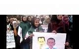 Female student protesters hold a poster of Obama with an Assad mask in Idlib, Syria (photo credit: Shaam News)