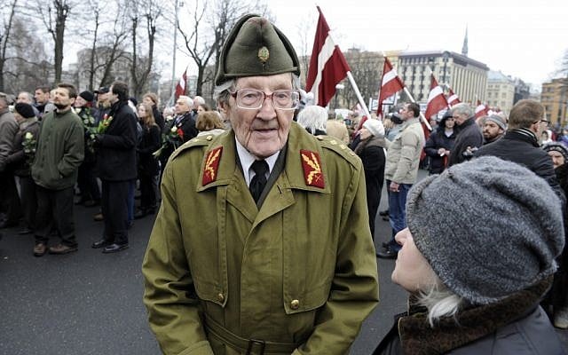 An elderly Latvian takes part in a ceremony to honor soldiers who fought in a Waffen SS unit during World War II, in Riga, Latvia, on Friday. (photo credit: AP/Roman Koksarov) An elderly Latvian takes part in a ceremony to honor soldiers who fought in a Waffen SS unit during World War II, in Riga, Latvia, on Friday. (photo credit: AP/Roman Koksarov)