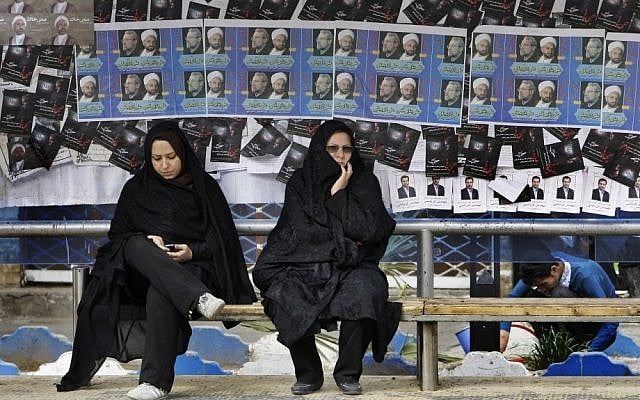 Iranian women surrounded by campaign posters at a bus stop, March 1, 2012 (photo credit: AP Photo/Vahid Salemi) Iranian women surrounded by campaign posters at a bus stop, March 1, 2012 (photo credit: AP Photo/Vahid Salemi)
