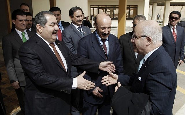 Iraqi foreign minister Hoshyar Zebari greets his Algerian counterpart in Baghdad (photo credit: AP/Mohammed Ameen) Iraqi foreign minister Hoshyar Zebari greets his Algerian counterpart in Baghdad (photo credit: AP/Mohammed Ameen)