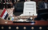 Syria's empty seat at the Baghdad summit (photo credit: AP/Karim Kadim)