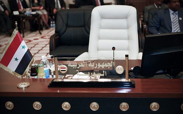 Syria's empty seat at the Baghdad summit (photo credit: AP/Karim Kadim)