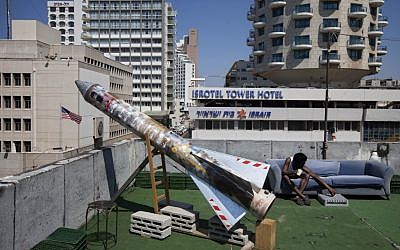A model of a rocket is displayed on a roof next to the US embassy as part of an art exhibition called 'Iran' at a gallery in Tel Aviv. (photo credit: AP/Oded Balilty)