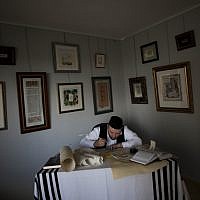 Calligraphy expert Avraham Borshevsky practices at his studio in Jerusalem. (photo credit: AP/Bernat Armangue)