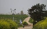 A soldier stands guard next to an Iron Dome battery near Ashdod (photo credit: AP/Ariel Schalit)