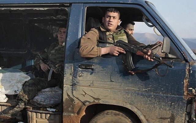 Lebanese soldiers near the Syrian border Tuesday (photo credit: Hussein Malla/AP)