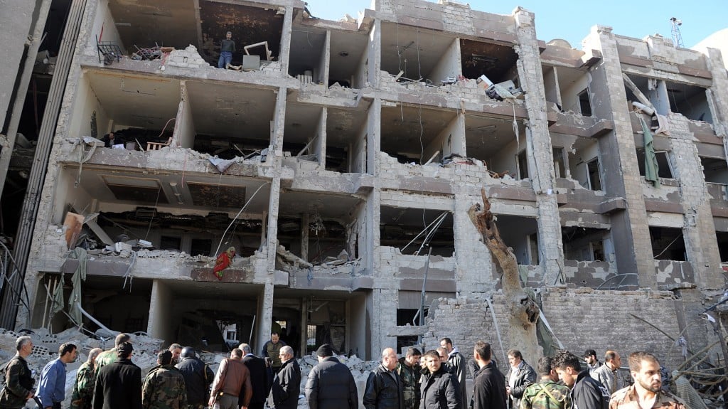 A damaged government building was attacked by one of two explosions in Damascus, Syria, on March 17, 2012. (photo credit: AP Photo/SANA)