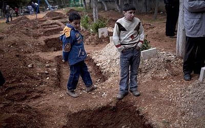 Children attend the funeral of three Free Syrian Army fighters in Idlib, Syria (photo credit: AP/Rodrigo Abd)