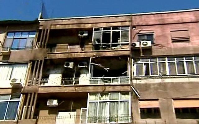 Damaged apartments  after clashes between the Syrian rebels and the Security forces, in the Mazzeh neighborhood of Damascus, Syria, on Monday (photo credit: AP Photo/SANA)