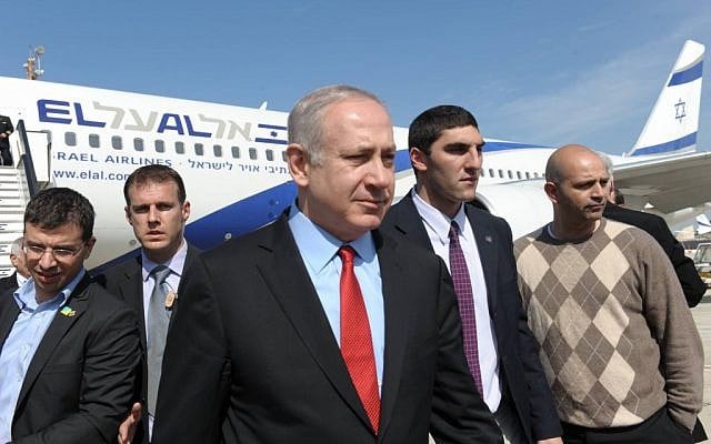 Prime Minister Benjamin Netanyahu in Ben Gurion airport after his return from his visit to Canada and the United States (photo credit: Amos Ben Gershom/GPO/Flash90)