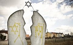 Illustrative: A monument at a Jewish cemetery in Wysokie Mazowieckie, Poland is found desecrated with anti-Semitic graffiti, March 2012 (Jedrzej Wojnar/AP)