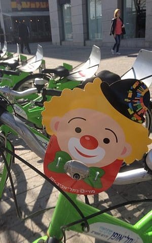 Clown on a bike (photo credit: Jessica Steinberg)