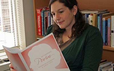 JWI staff member Lauren Levine reviewing the guide. (Photo credit: Courtesy)