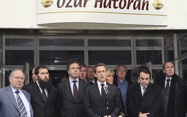 French President Nicolas Sarkozy, center, speaks in front of the Ozar Hatorah Jewish school in Toulouse, following a deadly shooting there on Monday morning. (photo credit: Eric Cabanis/AP) French President Nicolas Sarkozy, center, speaks in front of the Ozar Hatorah Jewish school in Toulouse, following a deadly shooting there on Monday morning. (photo credit: Eric Cabanis/AP)
