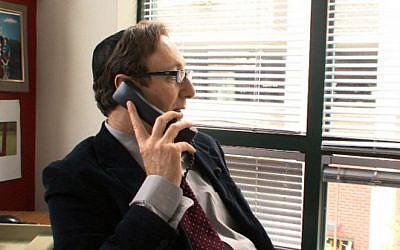 Phil Jacobs, a journalist who was vilified for reporting allegations of sexual abuse in Baltimore's Orthodox community, is the subject of the film 'Standing Silent.' The director of the LA Jewish Film festival called it a 'witch hunt.' (photo credit: 'Standing Silent'/via JTA)