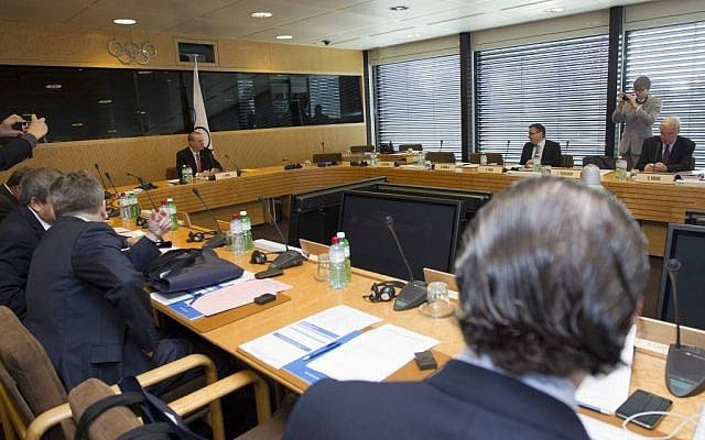 President of the IOC Belgian Jacques Rogge, background left, and members of the board wait for a meeting of the executive board in Lausanne, Switzerland, Tuesday (photo credit: Salvatore Di Nolfi, AP Photo/Keystone) President of the IOC Belgian Jacques Rogge, background left, and members of the board wait for a meeting of the executive board in Lausanne, Switzerland, Tuesday (photo credit: Salvatore Di Nolfi, AP Photo/Keystone)