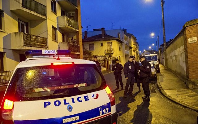 Illustrative: Police gather around the apartment building where Mohammed Merah barricaded himself in Toulouse in March 2012. (AP/Bruno Martin) Illustrative: Police gather around the apartment building where Mohammed Merah barricaded himself in Toulouse in March 2012. (AP/Bruno Martin)