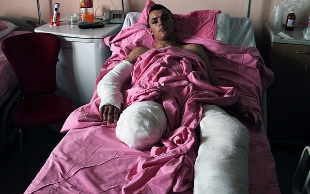 Muhammed Ibrahim, 18, lies in the Kemal Ataturk University hospital in Antakya, Turkey, on Thursday (photo credit: AP Photo/Gaia Anderson)