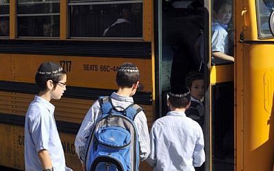 Illustrative: Jewish boys boarding a schoolbus in Brooklyn, New York (Serge Attal/Flash90)