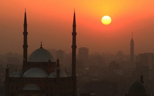 The sun sets over a mosque. (photo credit: Wissam Nassar/Flash90)