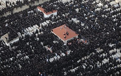 Thousands of ultra-Orthodox men attend the funeral of Rabbi Moshe Yehoshua Hager in Bnei Brak (photo credit: Yaakov Nahomie/Flash90)