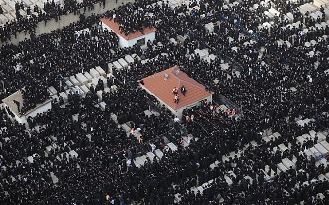Thousands of ultra-Orthodox men attend the funeral of Rabbi Moshe Yehoshua Hager in Bnei Brak (photo credit: Yaakov Nahomie/Flash90)