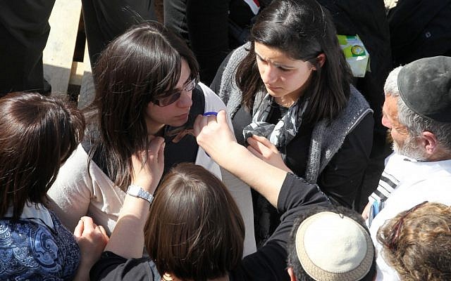 The wife of Rabbi Jonathan Sandler, 30, and mother to 6-year-old son Arieh and 3-year-old son Gabriel, mourns at their funeral in Jerusalem Wednesday. (photo credit: Nati Shohat/Flash90) The wife of Rabbi Jonathan Sandler, 30, and mother to 6-year-old son Arieh and 3-year-old son Gabriel, mourns at their funeral in Jerusalem Wednesday. (photo credit: Nati Shohat/Flash90)