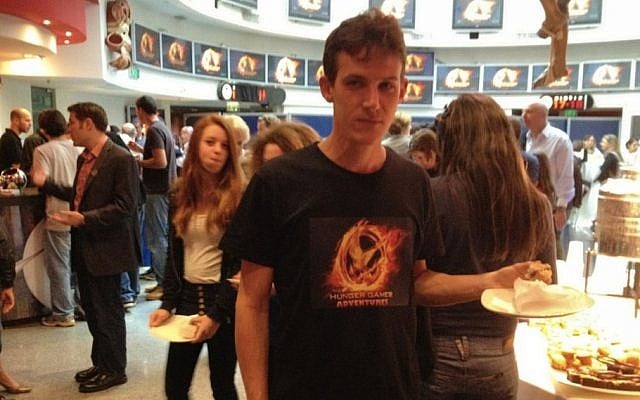 A Funtactix employee sports a T-shirt with the logo of The Hunger Games Adventures online game (Photo credit: Courtesy) A Funtactix employee sports a T-shirt with the logo of The Hunger Games Adventures online game (Photo credit: Courtesy)