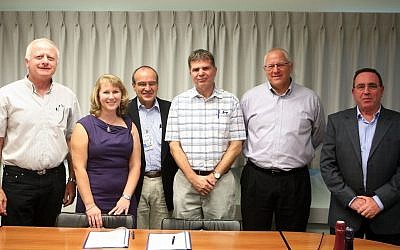 Intel and GE Healthcare staff celebrate the establishment of the partnership between the two companies, as they work together on an evaluation center in northern Israel (Photo credit: Courtesy)