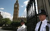 English policemen guard Big Ben and the Houses of Parliament in London (photo credit: Yossi Zamir/Flash90)