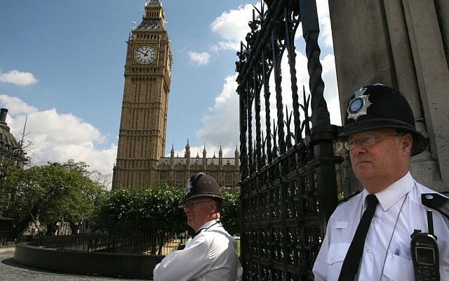 English policemen guard Big Ben and the Houses of Parliament in London (photo credit: Yossi Zamir/Flash90)