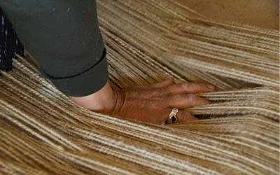 Pressing the weave (photo credit: Elio Nudelman) Pressing the weave (photo credit: Elio Nudelman)