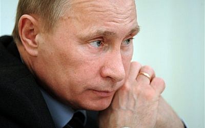 Prime Minister Vladimir Putin chairs a cabinet meeting in Moscow, Thursday. (photo credit: AP/RIA-Novosti, Alexei Druzhinin, Government Press Service)