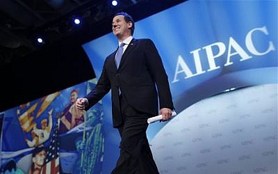 Republican presidential candidate, former Pennsylvania Sen. Rick Santorum, arrives to speak before the American Israel Public Affairs Committee (AIPAC), in Washington, on Tuesday. (photo credit: AP/Charles Dharapak)