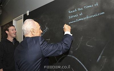 President Shimon Peres writes on Mark Zuckerberg's wall (Facebook)