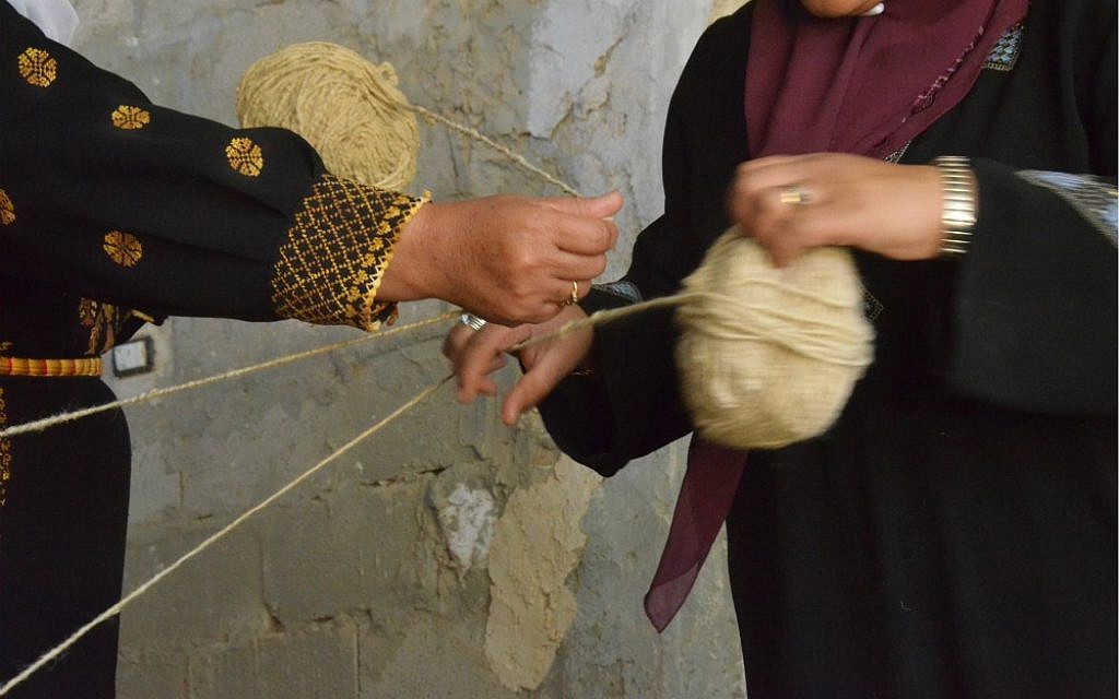 Wrapping skeins of wool (photo credit: Elio Nudelman)