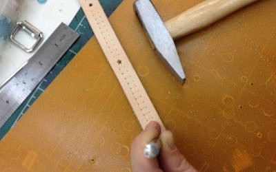 Stamping the leather (photo credit: Jessica Steinberg)