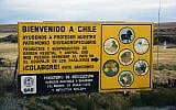 Entry sign at the Chilean border (photo credit: CC BA-SY Leonora Enking/Flikr)