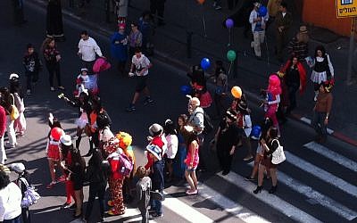 Children in costumes leave school in south Tel Aviv. (photo credit: Michal Shmulovich/Times of Israel)