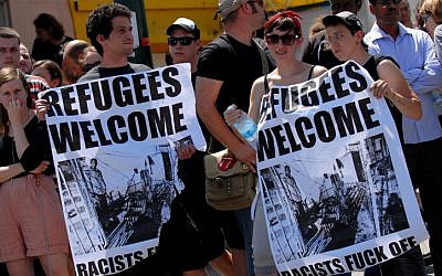 Demonstrators protest racist attacks on African migrants in Tel-Aviv on Friday (photo credit: Tomer Neuberg/Flash90)