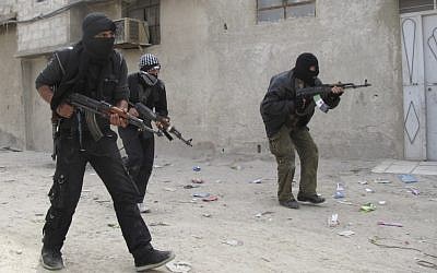 Free Syrian Army fighters train in a neighborhood of Damascus. (photo credit: AP)