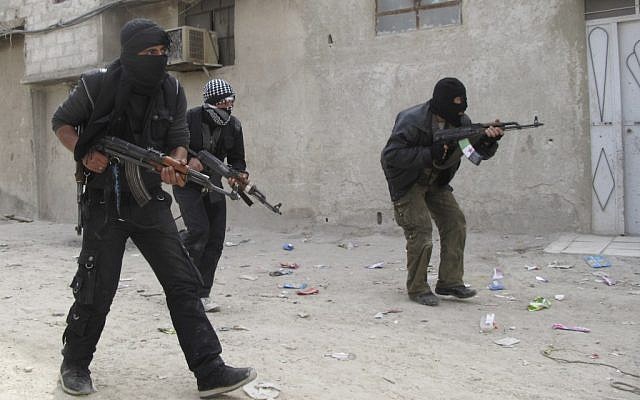 Free Syrian Army fighters train in a neighborhood of Damascus. (photo credit: AP)