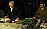 Benjamin Netanyahu visits the grave of his brother Jonathan, who was killed in action (photo credit: Avi Ohayon/GPO)