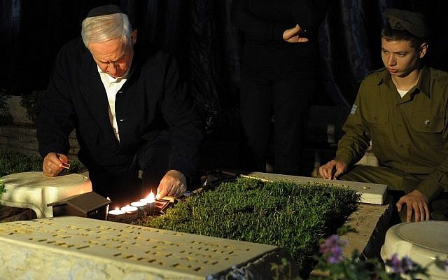 Benjamin Netanyahu visits the grave of his brother Jonathan, who was killed in action (photo credit: Avi Ohayon/GPO) Benjamin Netanyahu visits the grave of his brother Jonathan, who was killed in action (photo credit: Avi Ohayon/GPO)