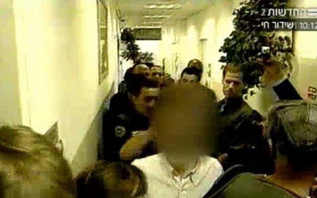 The CEO suspected of blackmail is brought in front of a judge on Wednesday (screen caption of Channel 2 News/Mako) The CEO suspected of blackmail is brought in front of a judge on Wednesday (screen caption of Channel 2 News/Mako)